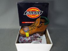 An unused pair of Dickies tan colour safety boots, size 12, in original box.