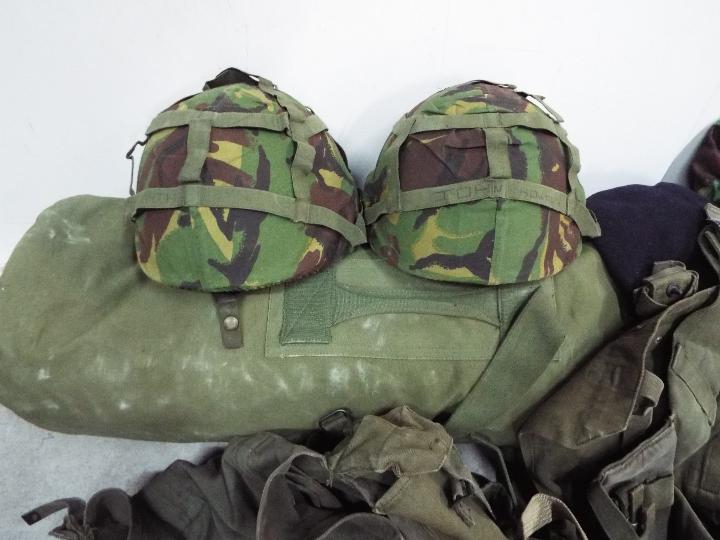 Military Equipment - Lot to include two combat helmets, GS mk6, decontamination kits, canvas bags, - Image 2 of 4