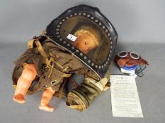 Two World War Two (WW2) British issue Gas Masks comprising a Baby's Gas Mask with full view window