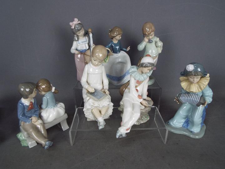 Nao - Seven figurines by Nao of children, largest approximately 21 cm (h).
