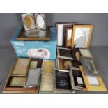 Thirty Picture frames of various sizes and a kitchen slicer.