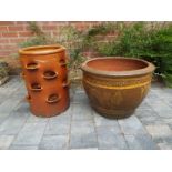 A salt glazed stoneware strawberry pot, 48 cm (h) x 35 cm (diam) and a large stoneware planter,