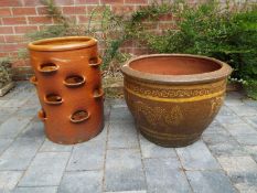 A salt glazed stoneware strawberry pot, 48 cm (h) x 35 cm (diam) and a large stoneware planter,