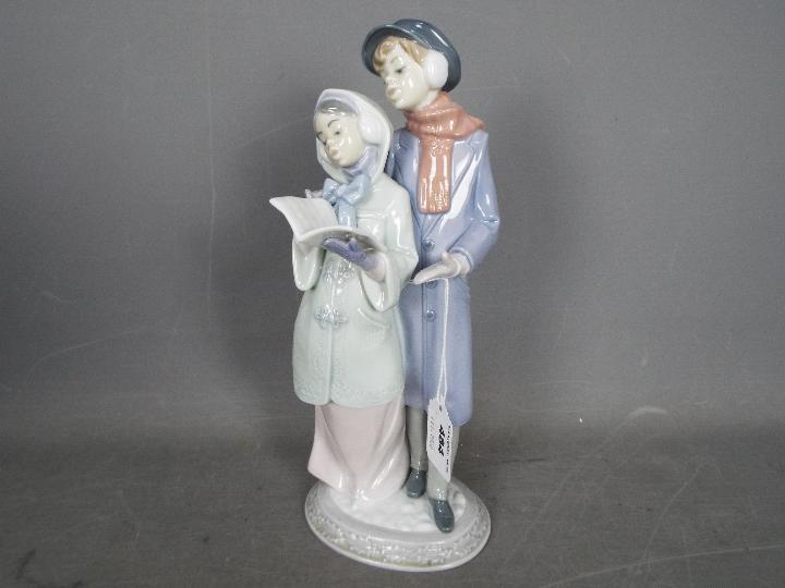 Lladro - A boxed Lladro figurine # 6218 Christmas Melodies depicting two carol singers, - Image 2 of 4