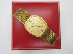 Omega - An 18ct gold cased Omega De Ville wristwatch on 18ct gold,