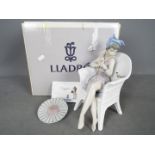 Lladro - A boxed figurine # 5666 Trino At The Beach, approximately 25 cm (h).