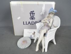 Lladro - A boxed figurine # 5666 Trino At The Beach, approximately 25 cm (h).