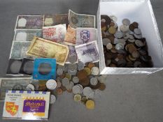 A collection of foreign and UK coins and banknotes.