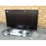 An LG flat screen television set model 43UH610V, and a dvd player,