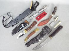 A collection of knives, multi tool and similar.