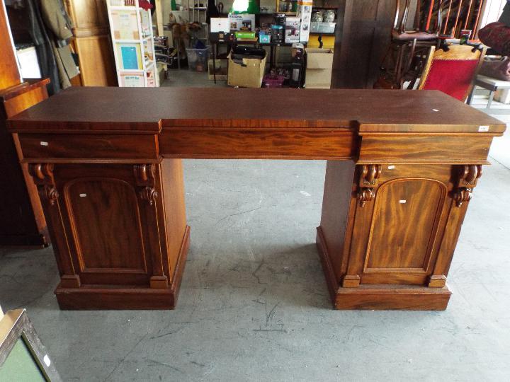 A substantial pedestal desk measuring 92 cm (h) x 183 cm (w) x 59 cm (d) the kneehole flanked by