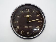 A car clock marked Jaeger, approx 8.