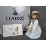 Lladro - A boxed figural group entitled Generous Gesture, # 6399,