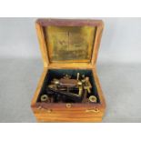 A brass nautical sextant marked 'Kelvin & Hughes, London 1917', contained in fitted box.