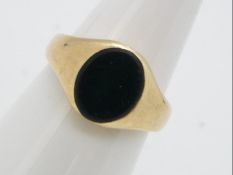 A 9ct yellow gold, stone set signet ring, size K, approximately 4.2 grams all in.