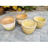 Two matched pairs of circular garden planters,