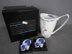 Sir Roger Moore - A 'Whatever It Takes' mug with artwork designed by Sir Roger Moore,