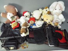 A collection of handbags and purses and a quantity of soft toys.