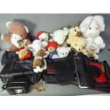 A collection of handbags and purses and a quantity of soft toys.