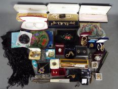 A collection of costume jewellery, fans, purses and similar.
