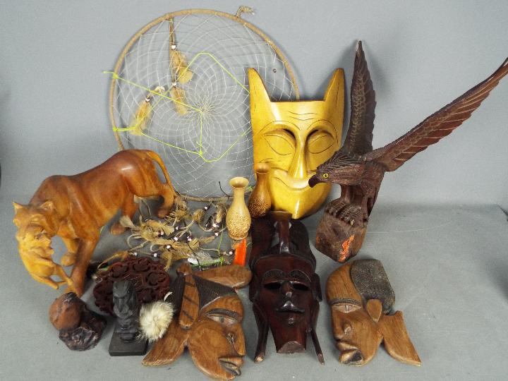 A quantity of treen, tribal carvings and similar.