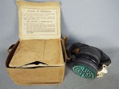 A World War Two (WW2) civilian's Gas Mask in canvas case Lot descriptions reflect the cataloguer's