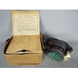 A World War Two (WW2) civilian's Gas Mask in canvas case Lot descriptions reflect the cataloguer's