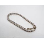 An 18ct white gold tennis bracelet set with 49 diamonds (approximately 5ct of diamonds),