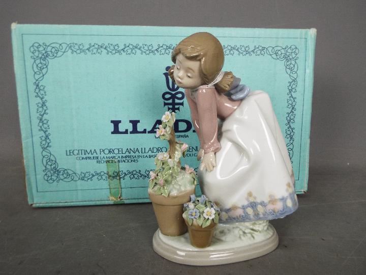 Lladro - a figurine entitled Pretty Posies in original box with internal packing pieces # 5548