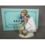 Lladro - a figurine entitled Pretty Posies in original box with internal packing pieces # 5548