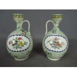 A pair of Copeland (Late Spode) ewer style vases with floral decoration, printed marks to the base,