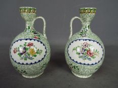 A pair of Copeland (Late Spode) ewer style vases with floral decoration, printed marks to the base,