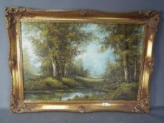 A large oil on canvas landscape scene depicting a woodland setting,