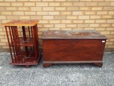 A linen chest measuring approximately 51 cm x 95 cm x 51 cm and a revolving bookcase 69 cm x 45 cm