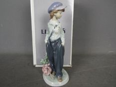 Lladro - A boxed figurine entitled The Wanderer, # 5400, approximately 21 cm (h).