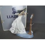 Lladro - A boxed figurine entitled Sweet Symphony, # 6243,