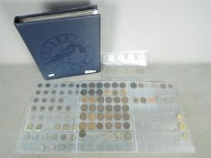 A binder containing a collection of UK and foreign coins, commemorative crowns, Victorian and later,