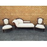 A three-piece suite comprising chaise longue and two armchairs each with matching cream upholstery