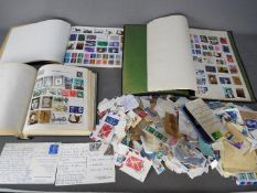 Philately - a Quckchange stamp album containing a quantity of UK and worldwide postage stamps,