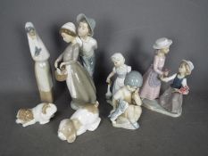 A collection of Spanish Porcelain figurines, predominantly by Nao, largest approximately 29 cm (h).