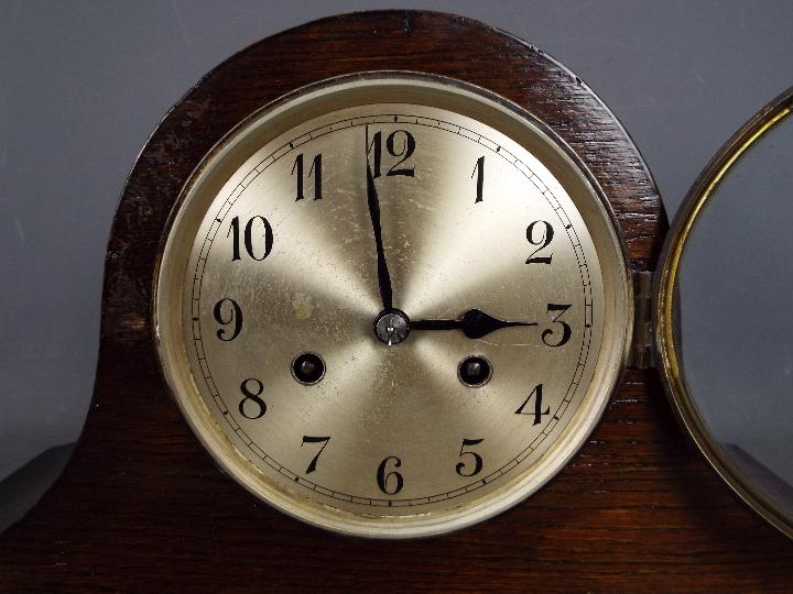 An oak cased Napoleons hat mantel clock with Arabic numerals to the dial, with key and pendulum. - Image 3 of 7