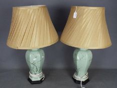 A pair of decorative table lamps, approximately 64 cm (h) including shades.