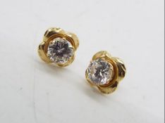 A pair of stone set stud earrings, butte