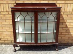 A twin door glazed bookcase or display c