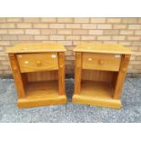 A pair of pine bedside cabinets measuring approximately 61 cm x 52 cm x 43 cm.