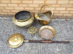 A collection of various brassware.