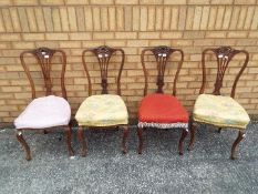 Four upholstered chairs.