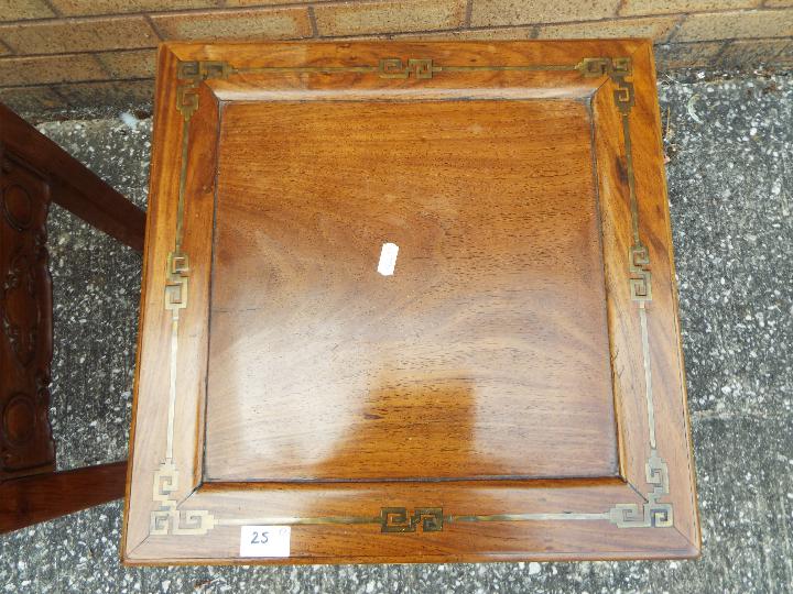 A pair of lamp tables with carved detailing and brass inlay, approximately 49 cm x 41 cm x 41 cm. - Image 2 of 2