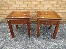 A pair of lamp tables with carved detailing and brass inlay, approximately 49 cm x 41 cm x 41 cm.