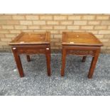 A pair of lamp tables with carved detailing and brass inlay, approximately 49 cm x 41 cm x 41 cm.